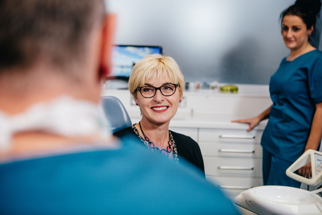 Dentist and patient discussing porcelain veneers at Castelnau Dentists Barnes